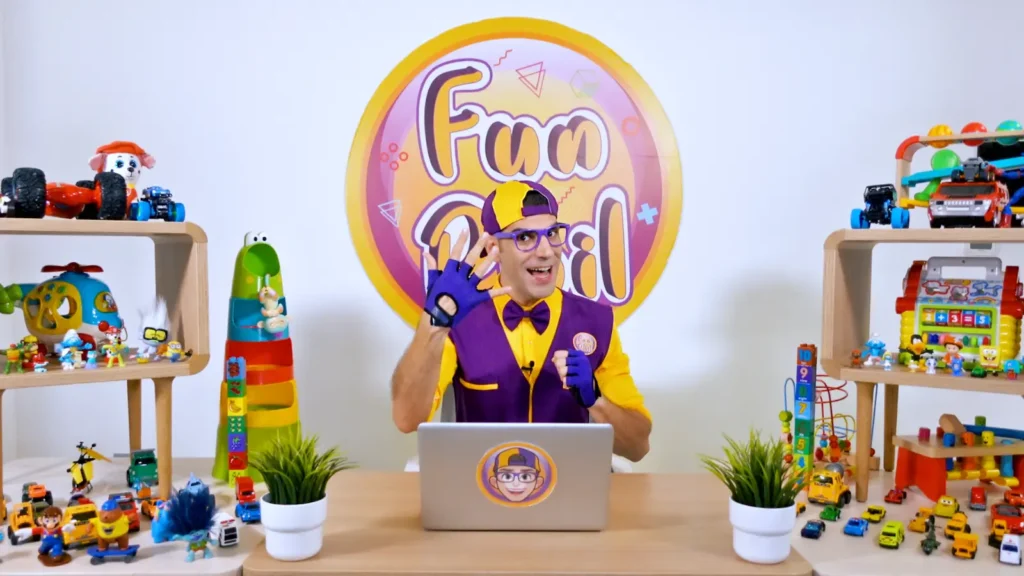 Fun Phil in his toy-filled studio getting ready for a learning adventure
